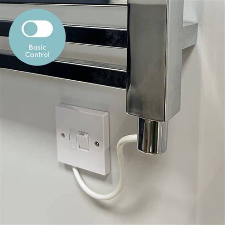 How do you control the temperature on a towel rail?