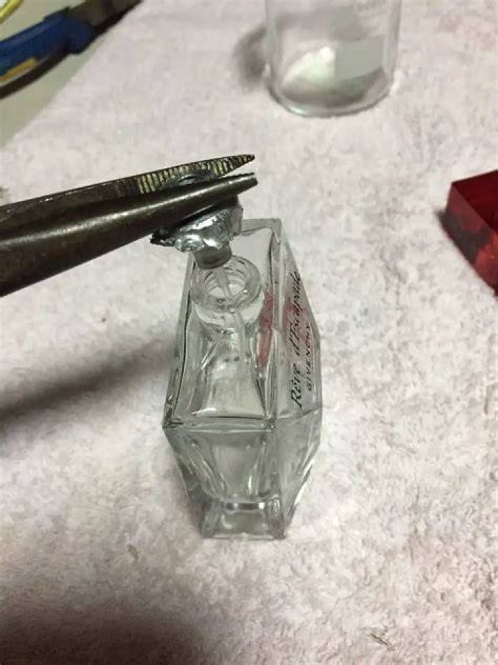 How do you get perfume out of a bottle?