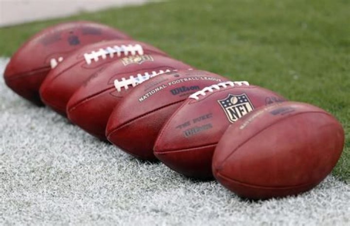 How many footballs are used in an NFL game?