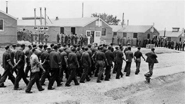 How many men survived the march to the POW camp?