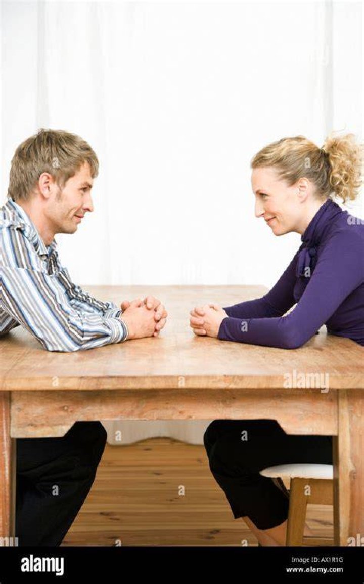 Should couples sit across from each other?