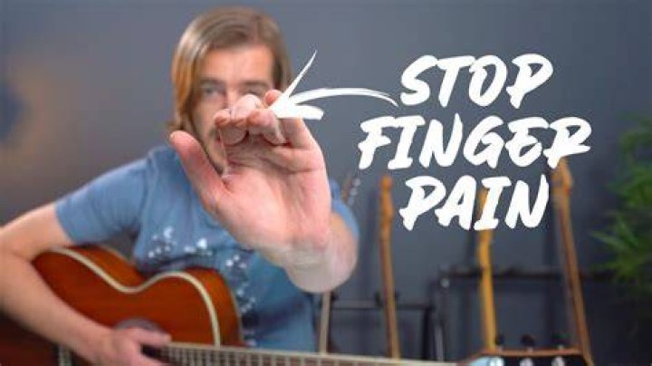 Should I stop playing guitar if my fingers hurt?