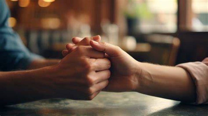What does it mean when someone squeezes your hand 3 times?