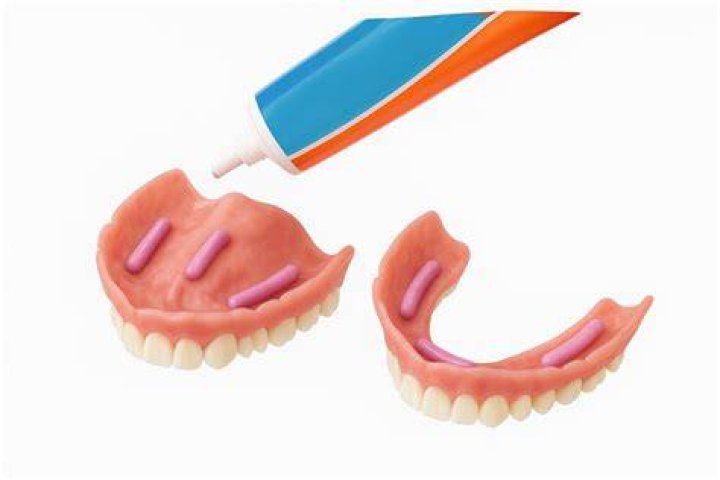 What happens if you use too much denture adhesive?