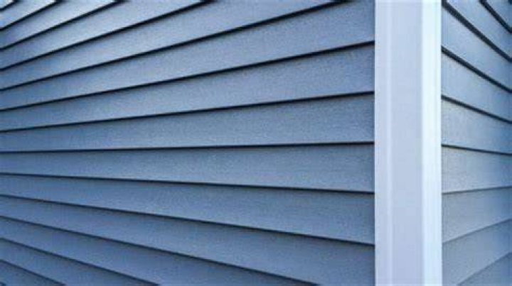 What is more expensive stucco or vinyl siding?