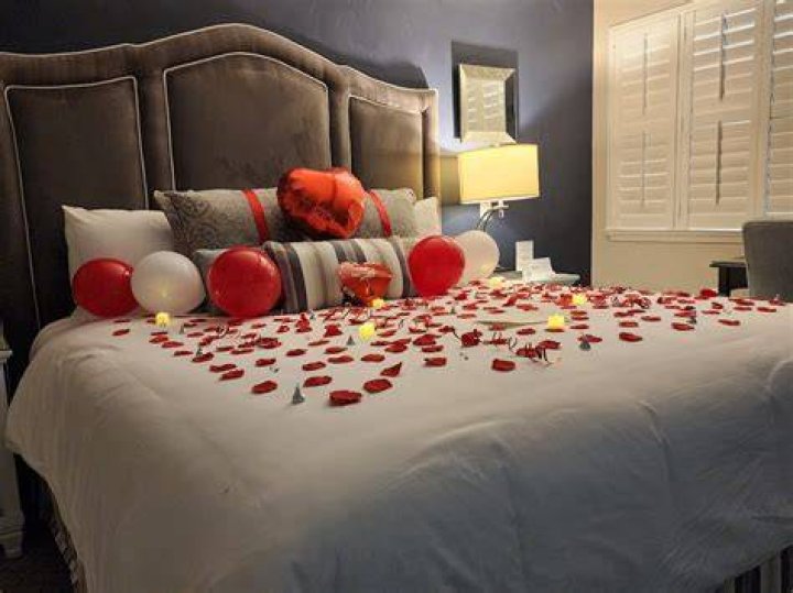 What is the first thing to do in the bedroom turndown?