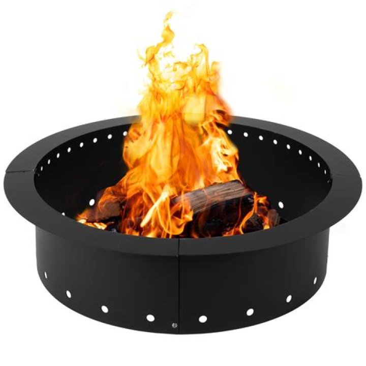 What is the purpose of the metal ring in a fire pit?
