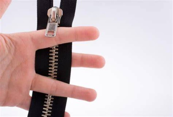 Why are girls zippers opposite?