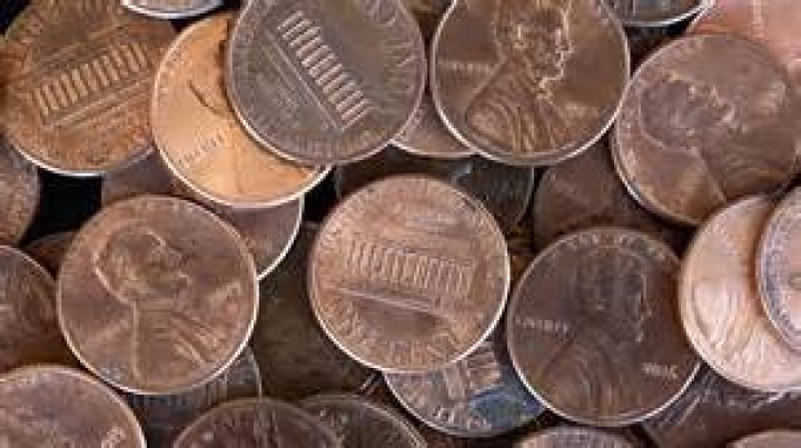 Why did Della save pennies?