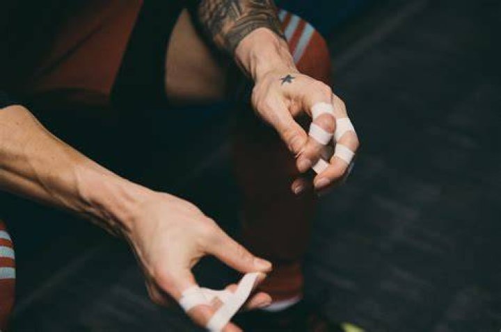Why do football players tape their fingers?