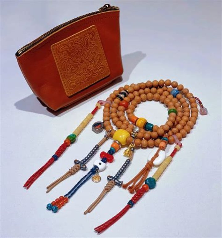 Why do men carry beads?