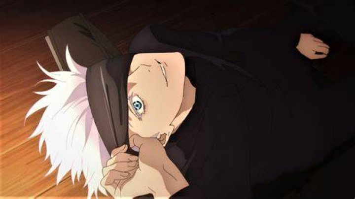 Why does Gojo remove his blindfold?