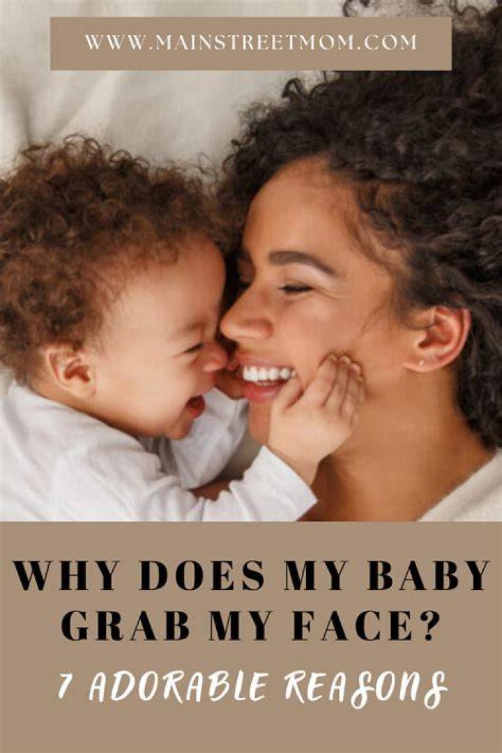 Why does my baby keep his hands by his face?