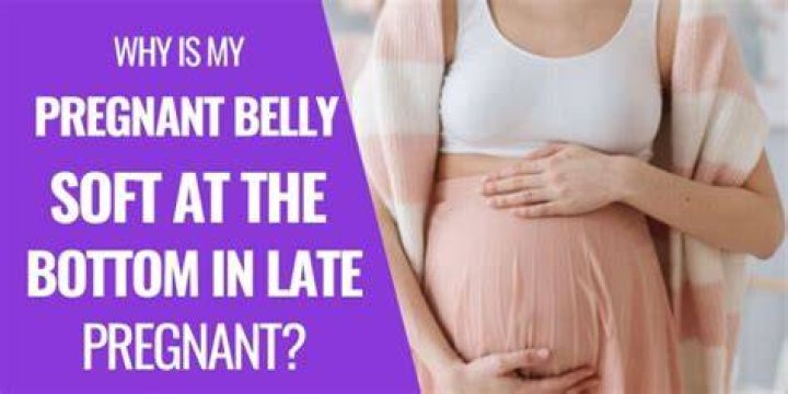 Why is my stomach hard at the top and soft at the bottom pregnant?